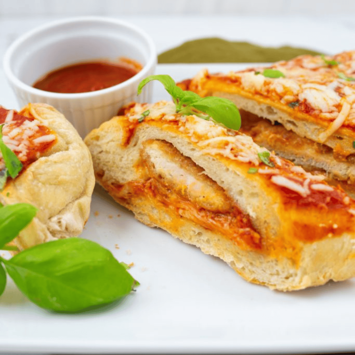 Air Fryer Chicken Parmesan Calzone with golden crust, filled with juicy chicken, marinara sauce, and melted cheese.