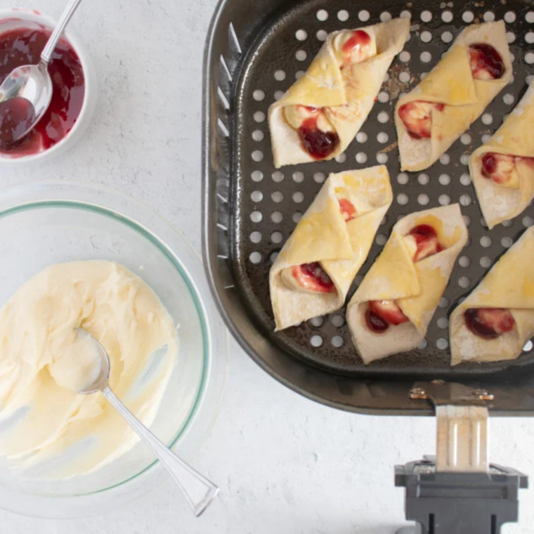 Air fryer puff pastry Danish arranged in a single layer in the air fryer basket
