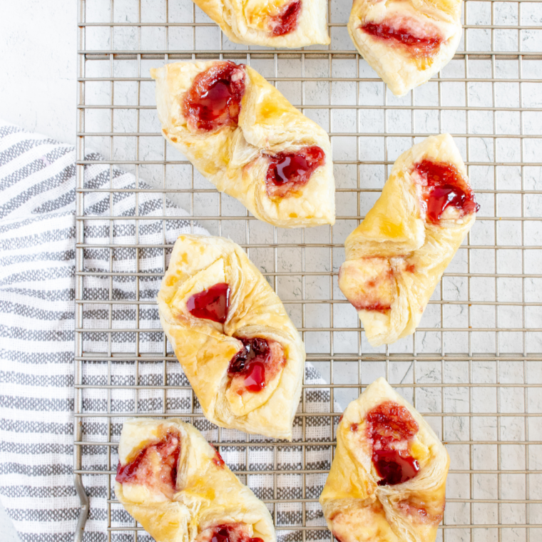 Flaky air fryer puff pastry Danish showing golden layered edges and jam center