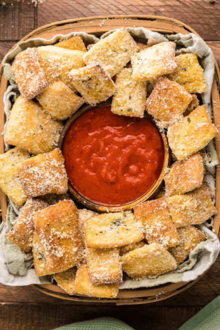 Copycat Domino's Garlic Bread Bites with Parmesan cheese and dipping sauce.