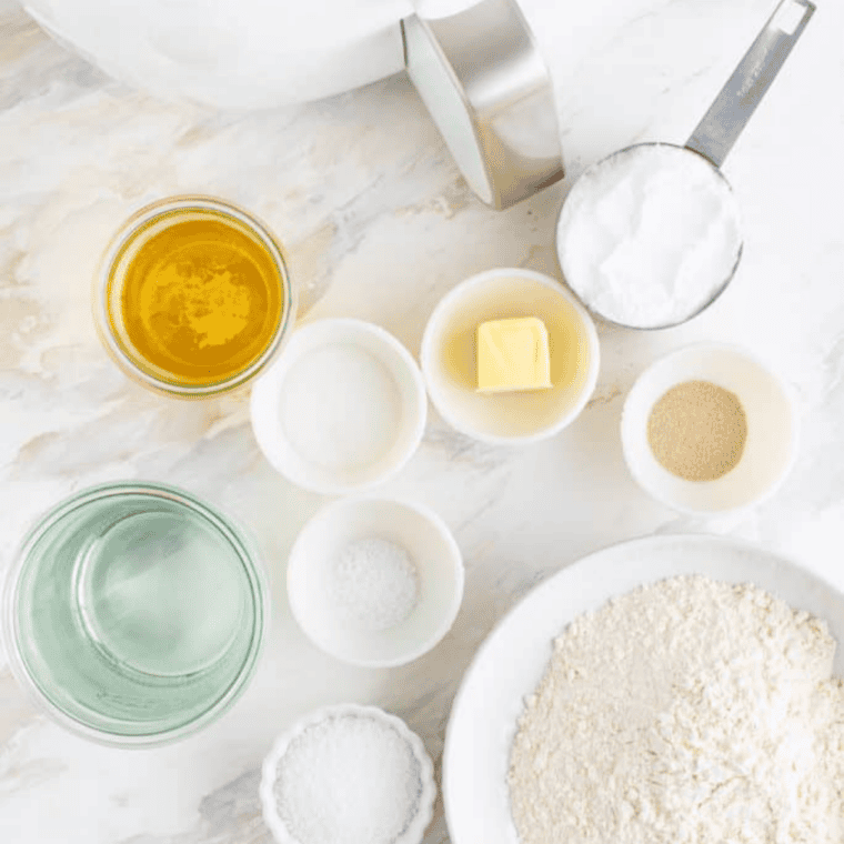 Ingredients for air fryer copycat Auntie Anne's pretzels: flour, yeast, sugar, butter, salt, and baking soda
