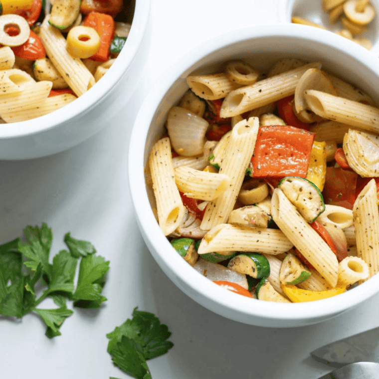 Tender pasta tossed with air-fried cherry tomatoes, zucchini, bell peppers, and onions in a bright homemade Italian dressing. Ready in 30 minutes — perfect for BBQs, meal prep, and summer dinners.