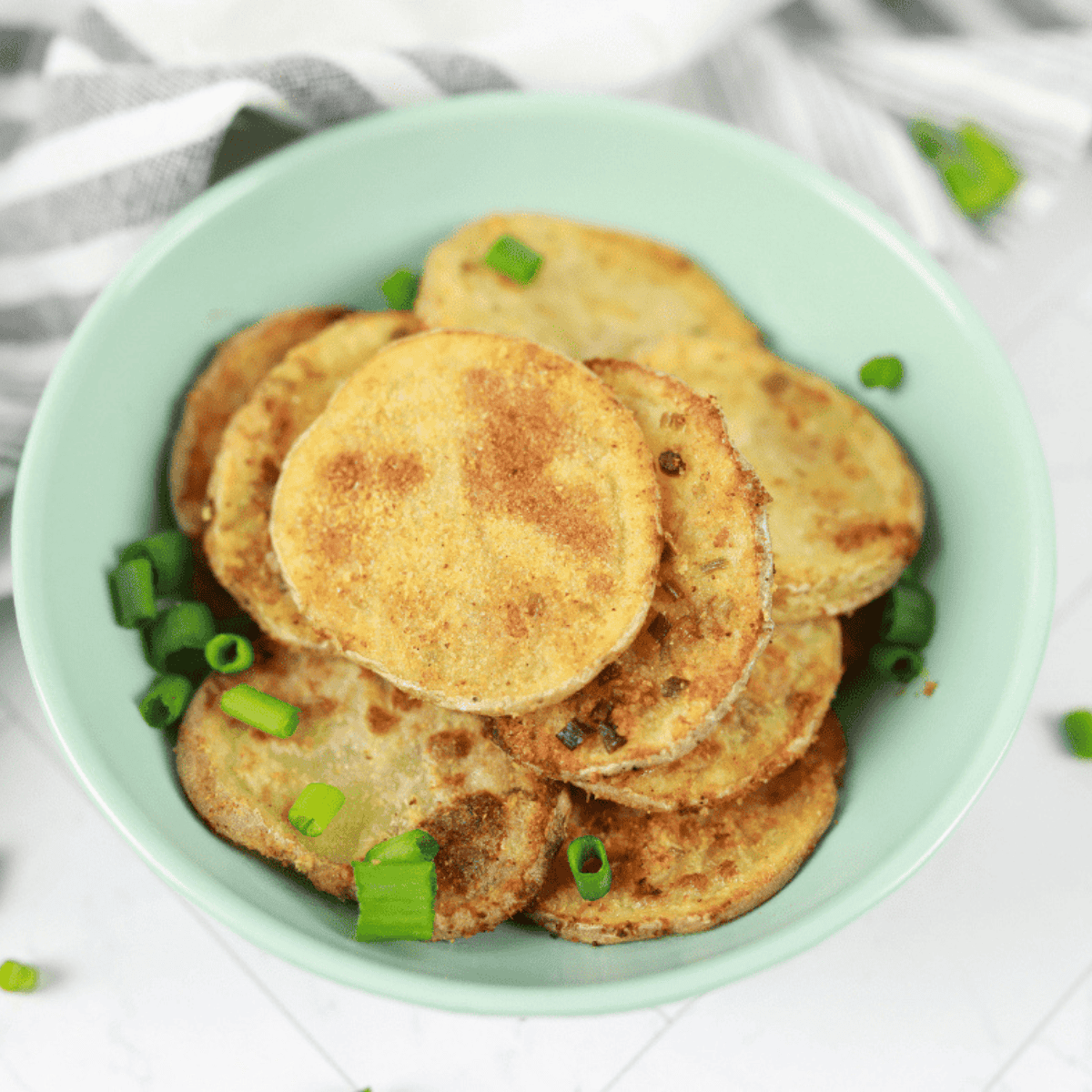 Crispy air fryer sour cream and onion potato chips in a bowl.
