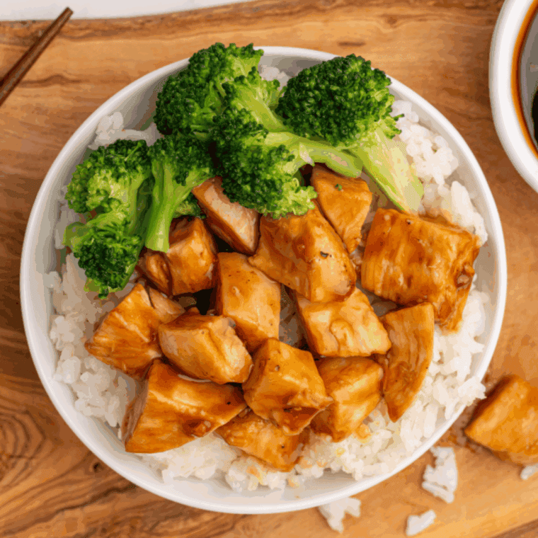 Air Fryer Chicken Teriyaki Bowl with juicy chicken, steamed vegetables, and white rice drizzled with teriyaki sauce.