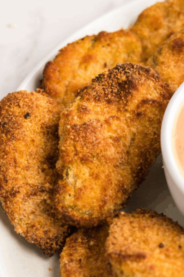 Copycat Hooters fried pickles with dipping sauce, made in the air fryer