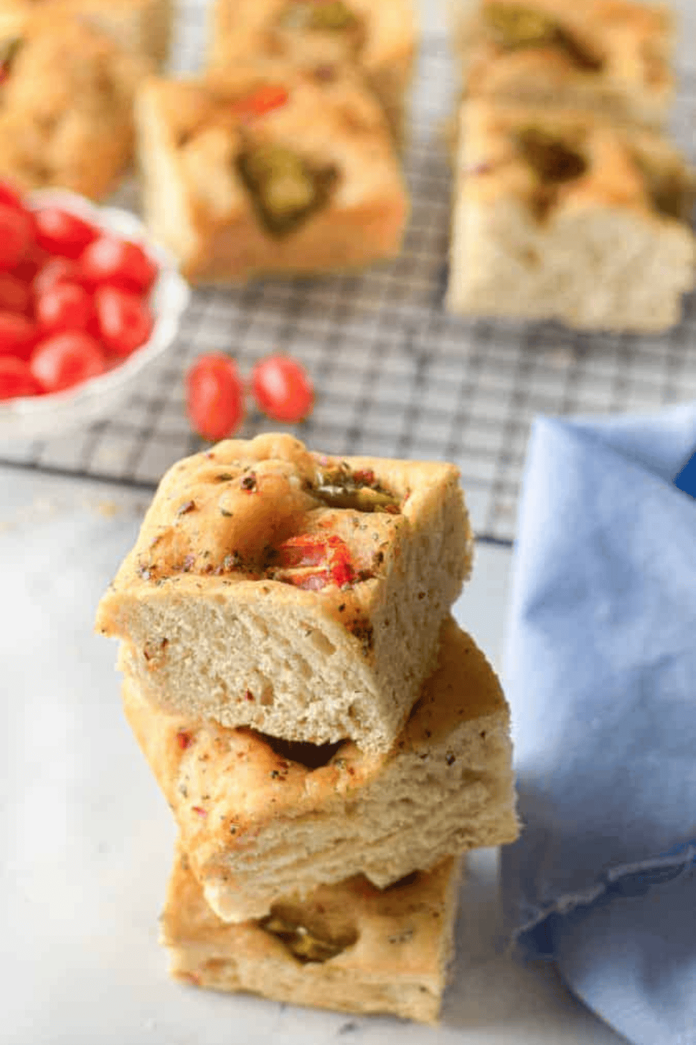 Freshly baked golden focaccia bread made in the Instant Pot, topped with herbs and vegetables, ready to serve.