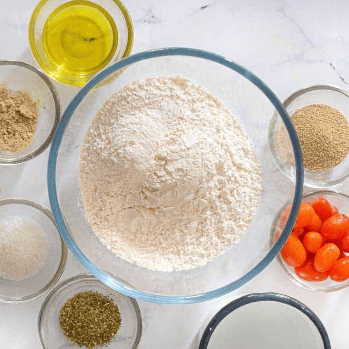 Ingredients needed for Instant Pot Focaccia Bread on kitchen table.