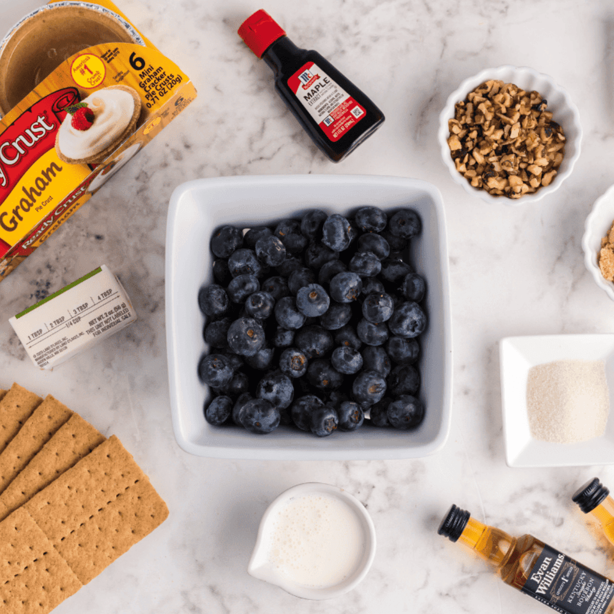 Ingredients needed for Air Fryer Blueberry Crumb Cake on kitchen table.