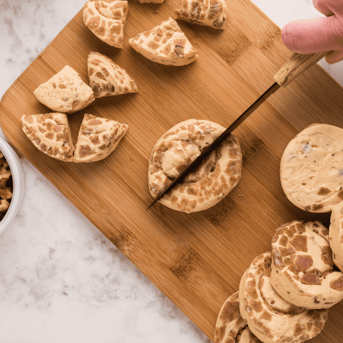 Cut cinnamon rolls into pieces and set aside while air fryer preheats