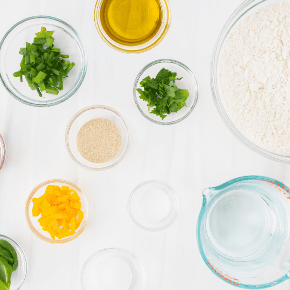 Ingredients needed for Air Fryer Garden Focaccia on kitchen table.