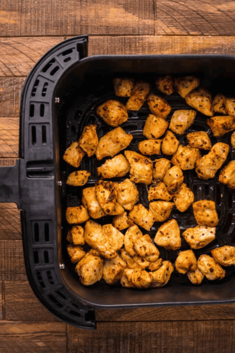 Cooked Guava Chicken in the air fryer basket.