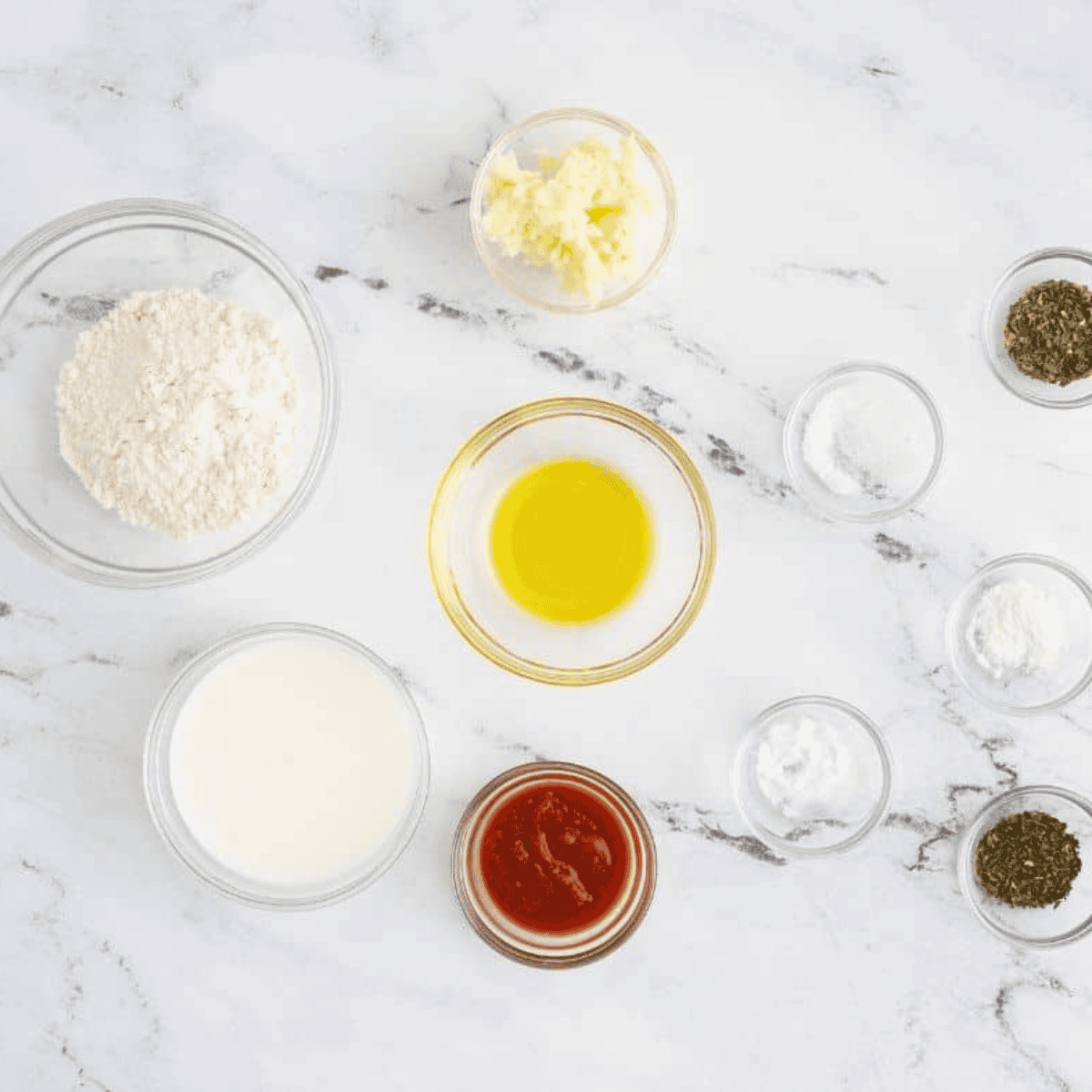 Ingredients needed for Air Fryer Mug Pizza on kitchen table.