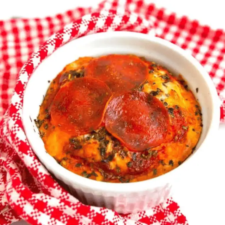 Air fryer mug pizza in a mug with melted cheese and pepperoni
