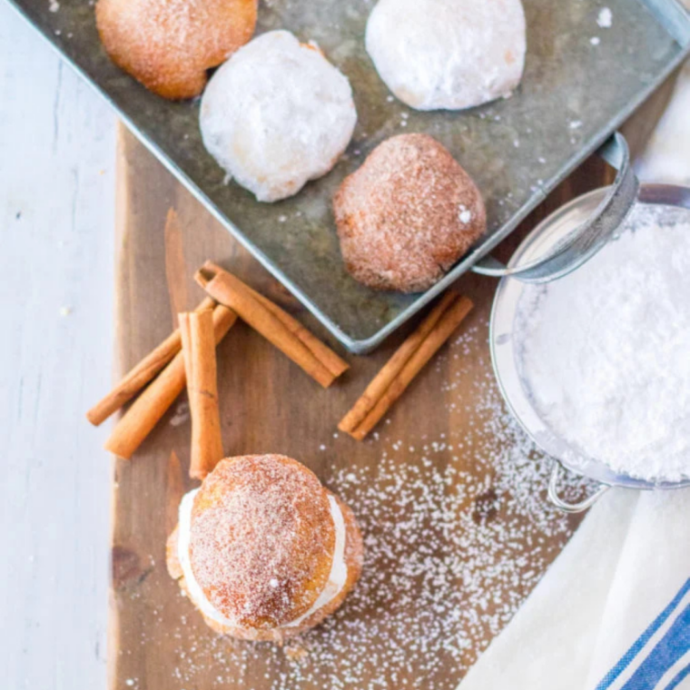 Close-up of air fryer pumpkin cheesecake donut holes coated in cinnamon sugar