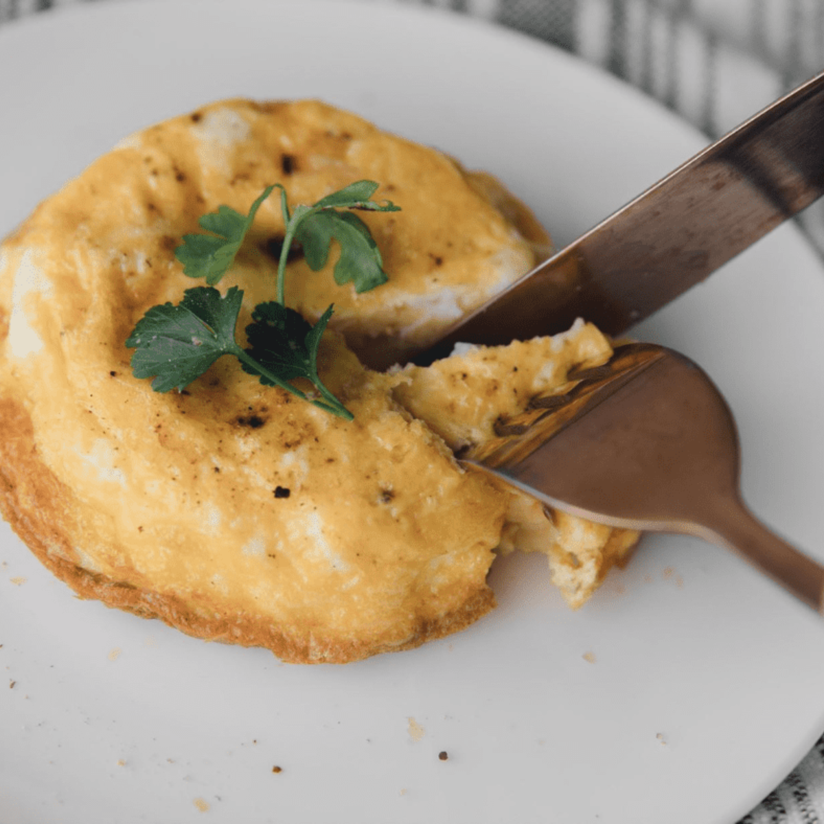 Sliced air fryer Spanish tortilla showing soft center and crisp edges