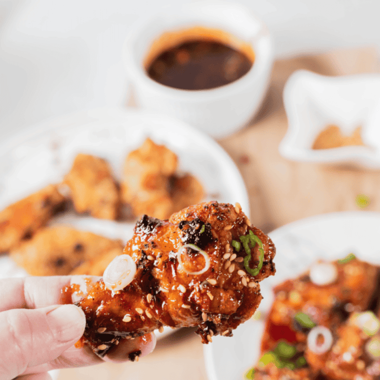 Crispy Copycat Wingstop Atomic Wings coated in spicy sauce