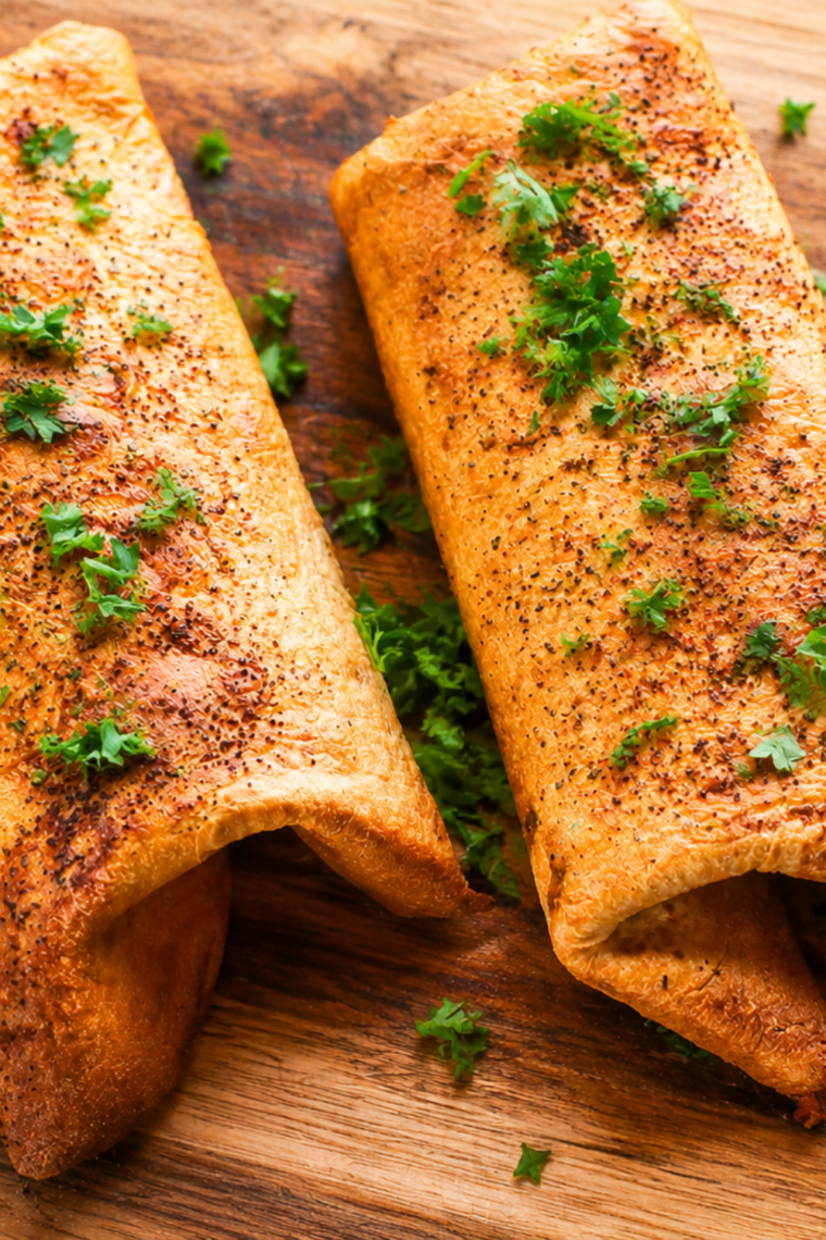 Air fryer turkey wraps sliced on the diagonal with melted mozzarella showing