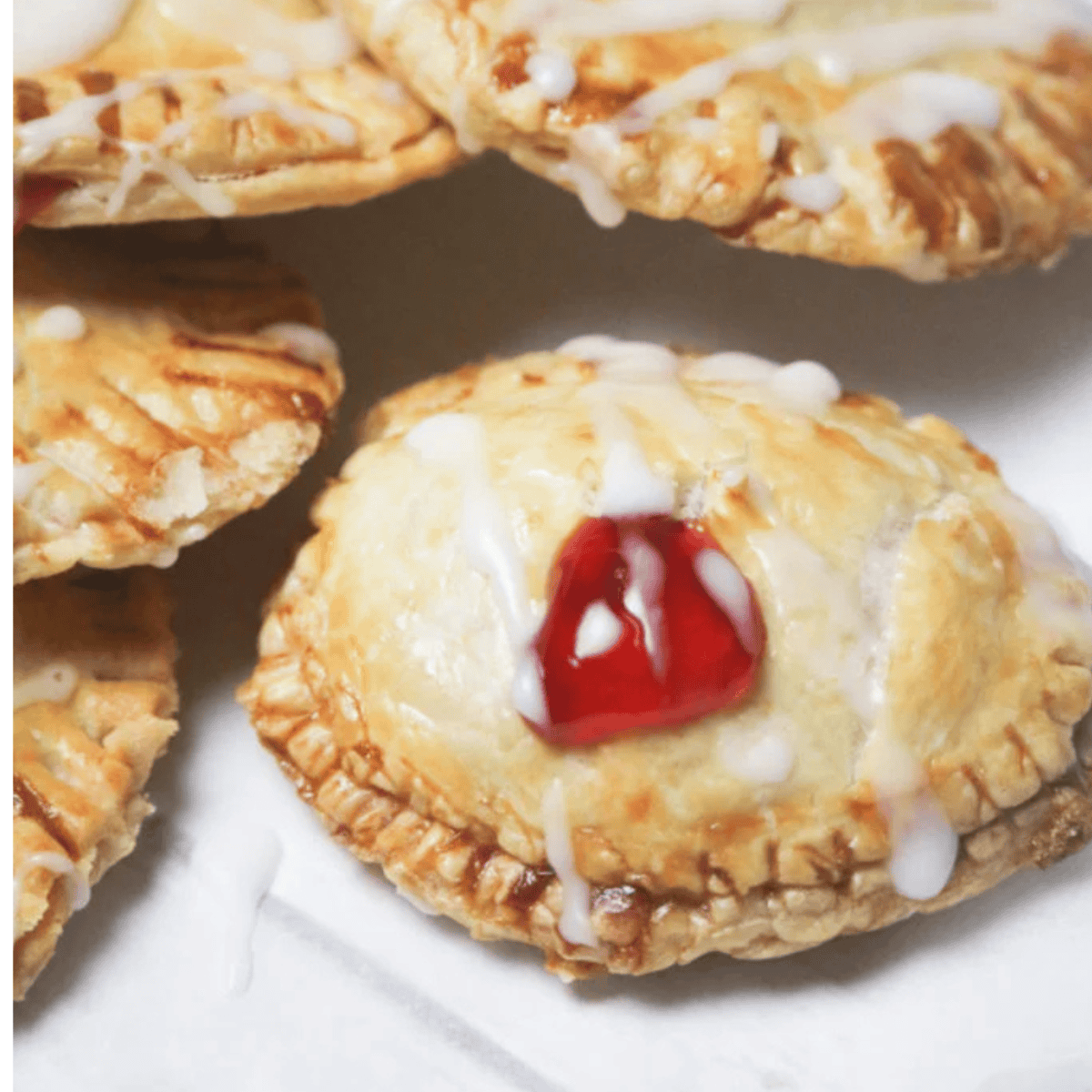Golden air fryer cherry pie bombs with flaky crust and sweet cherry filling
