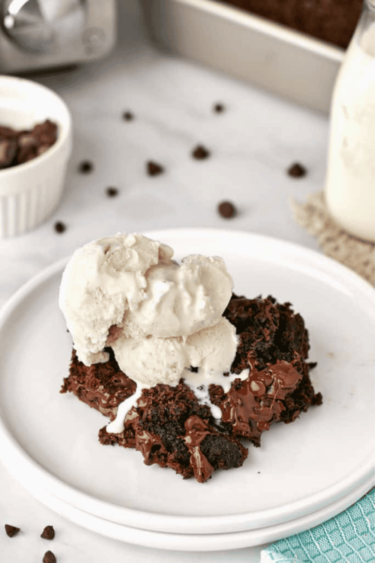 Serving of chocolate dump cake on a plate with a fork