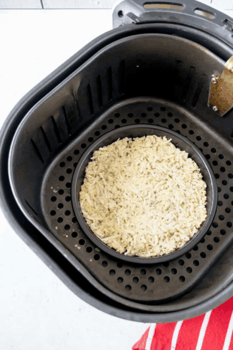 shredded mozzarella, Parmesan, egg, and seasonings mixed in a bowl, pan sprayed with non-stick cooking spray