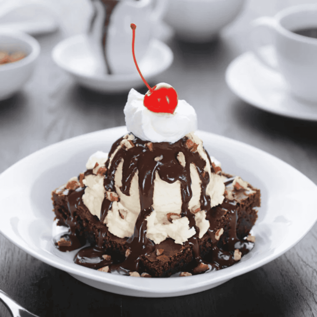 Single serve air fryer brownie in a ramekin with a fudgy center, crackly top, and melted chocolate chips.