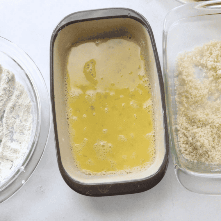 Whisking ice-cold club soda into flour and cornstarch to make a lumpy tempura batter