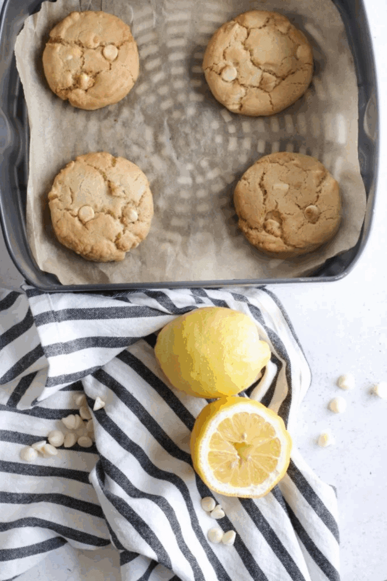 Golden-brown lemon cookies filled with white chocolate chips fresh from the air fryer.