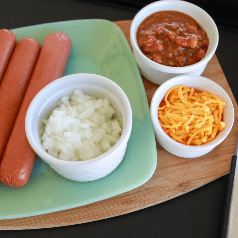 Ingredients needed for Blackstone Hot Dogs (Crispy, Juicy & Done in 7 Minutes!) on kitchen table.
