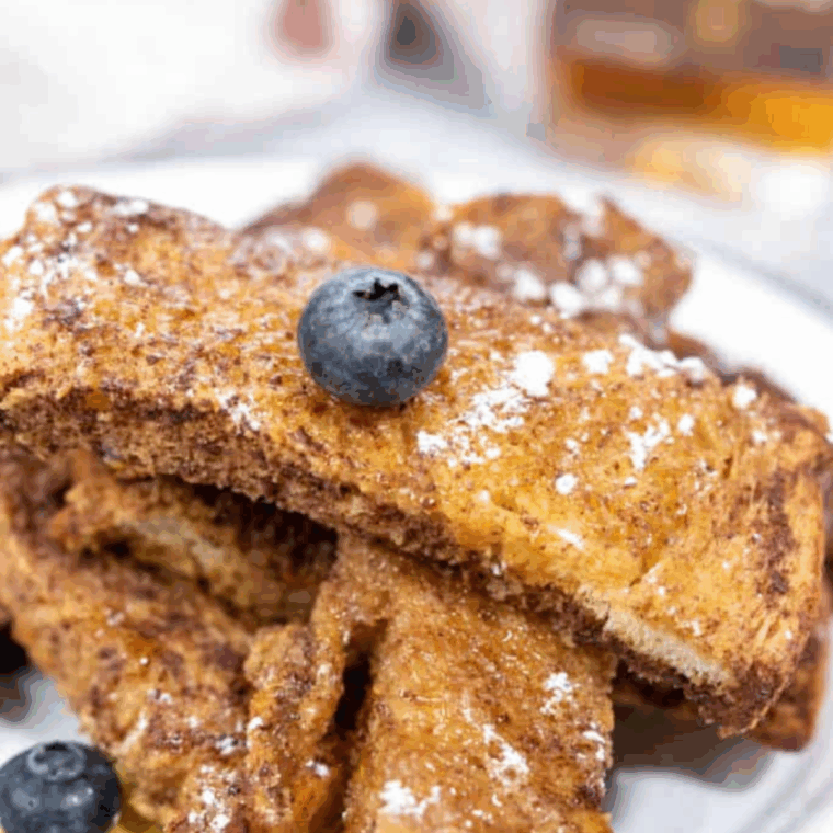 air fryer copycat sonic french toast sticks on a plate with syrup