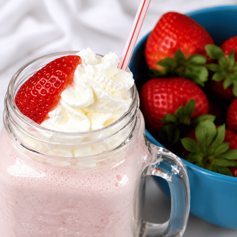 Close-up of a thick, creamy Ninja Creami strawberry milkshake