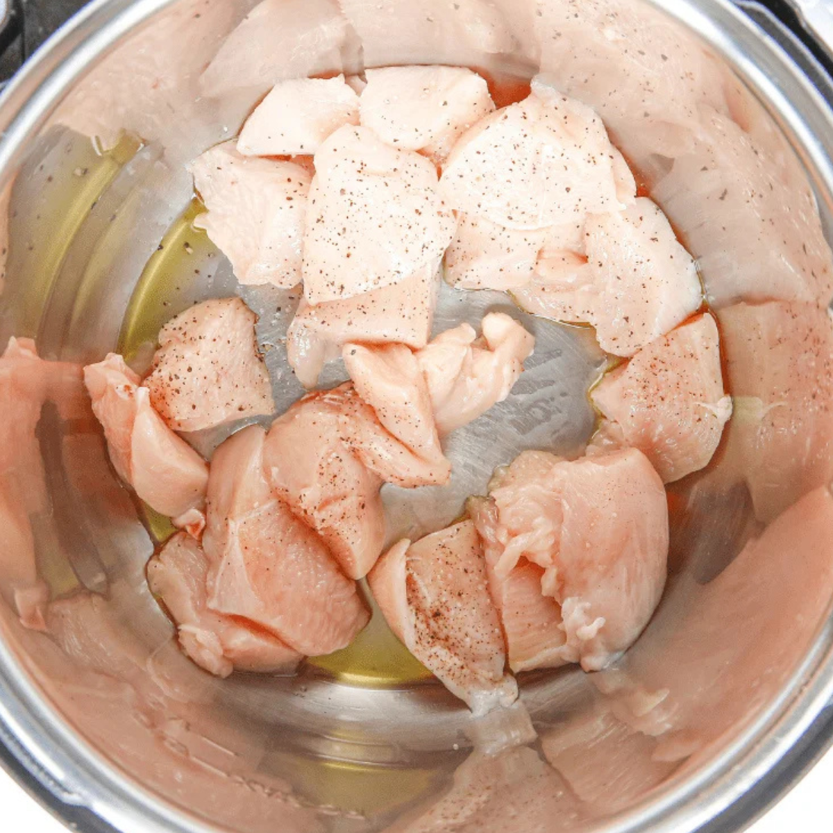 chicken thighs, broth, shiitakes and aromatics added to a slow cooker for chicken ramen