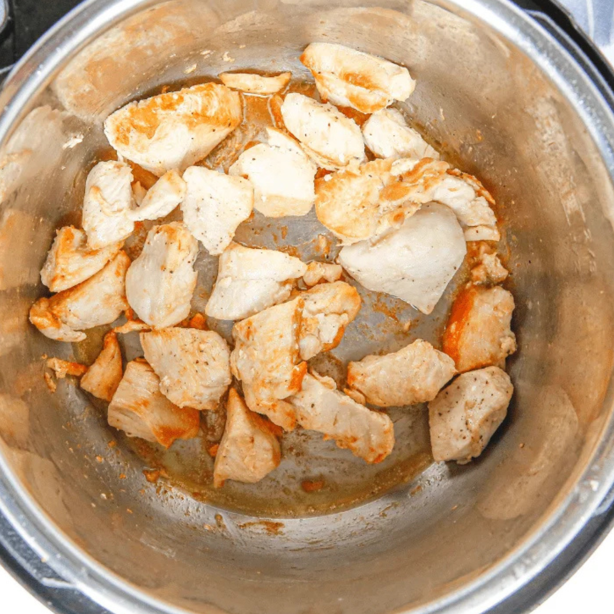 slow cooker with lid on set to low, cooking chicken ramen broth