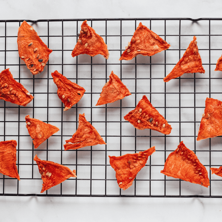 Chewy air fryer dehydrated watermelon slices in a glass jar.