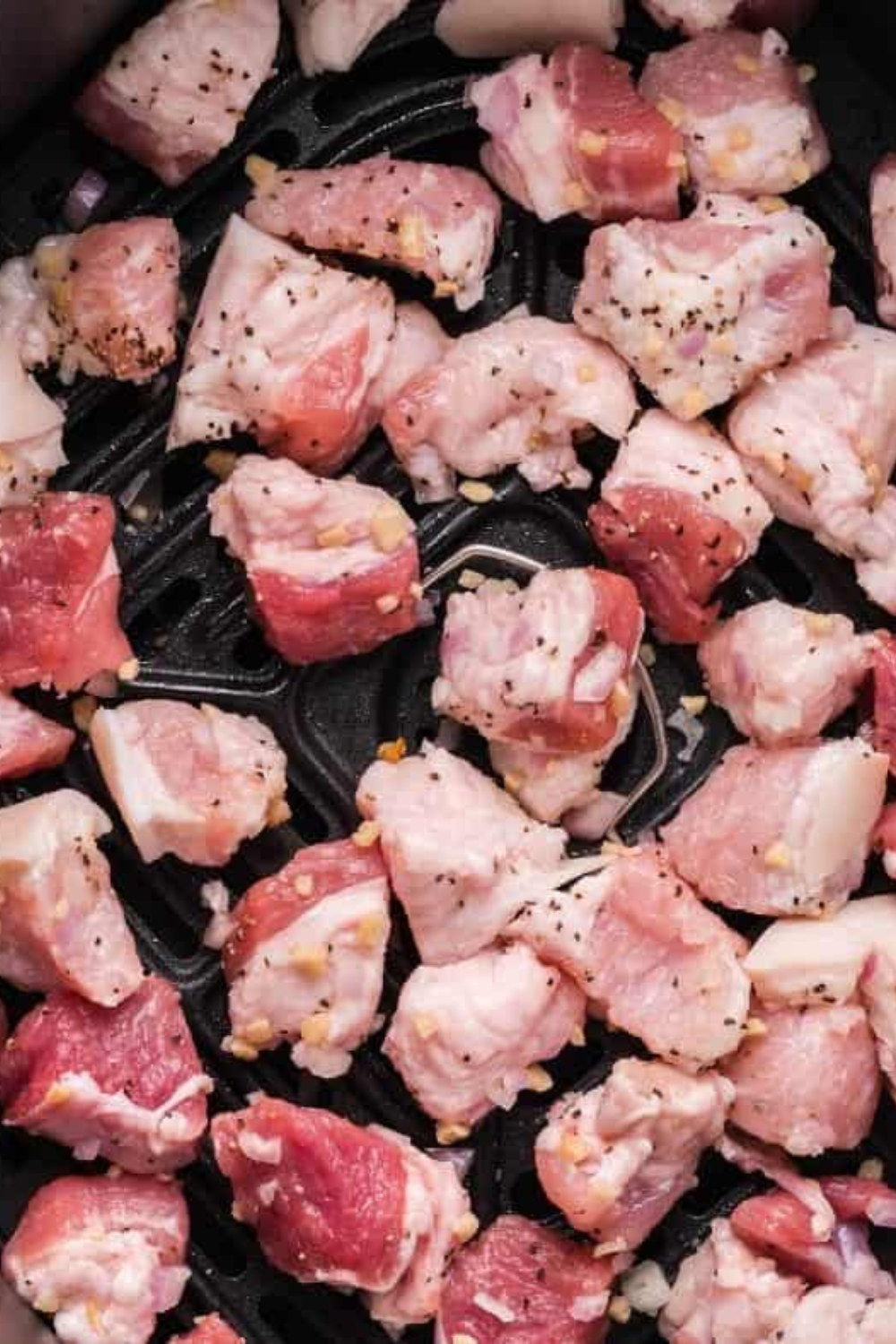 Small bowls of brown sugar, smoked paprika, garlic powder, kosher salt and black pepper for pork belly rub