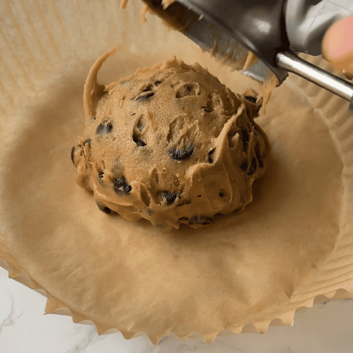 Air fryer single serve chocolate chip cookie baked until soft and gooey