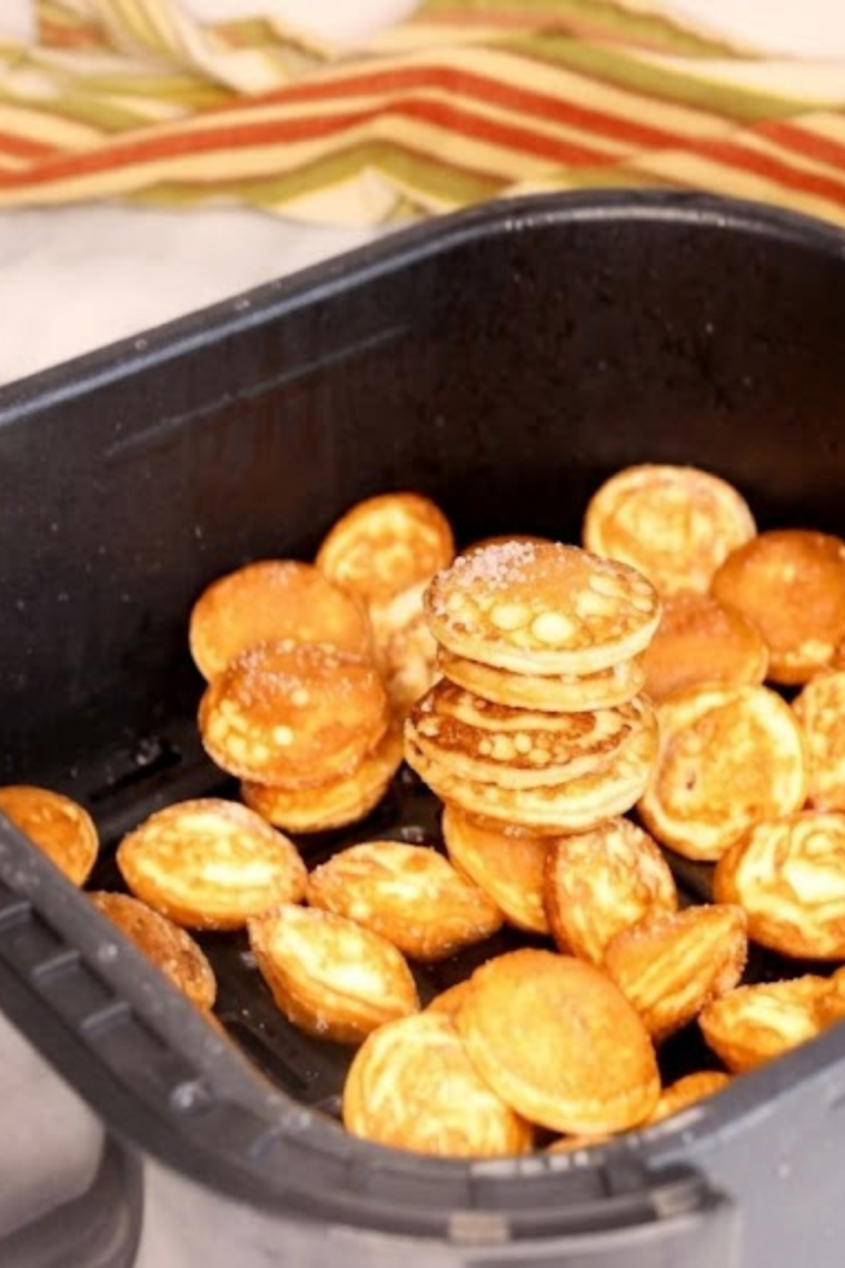 Frozen Trader Joe’s pancake puffs placed into an air fryer basket without thawing or oil spray