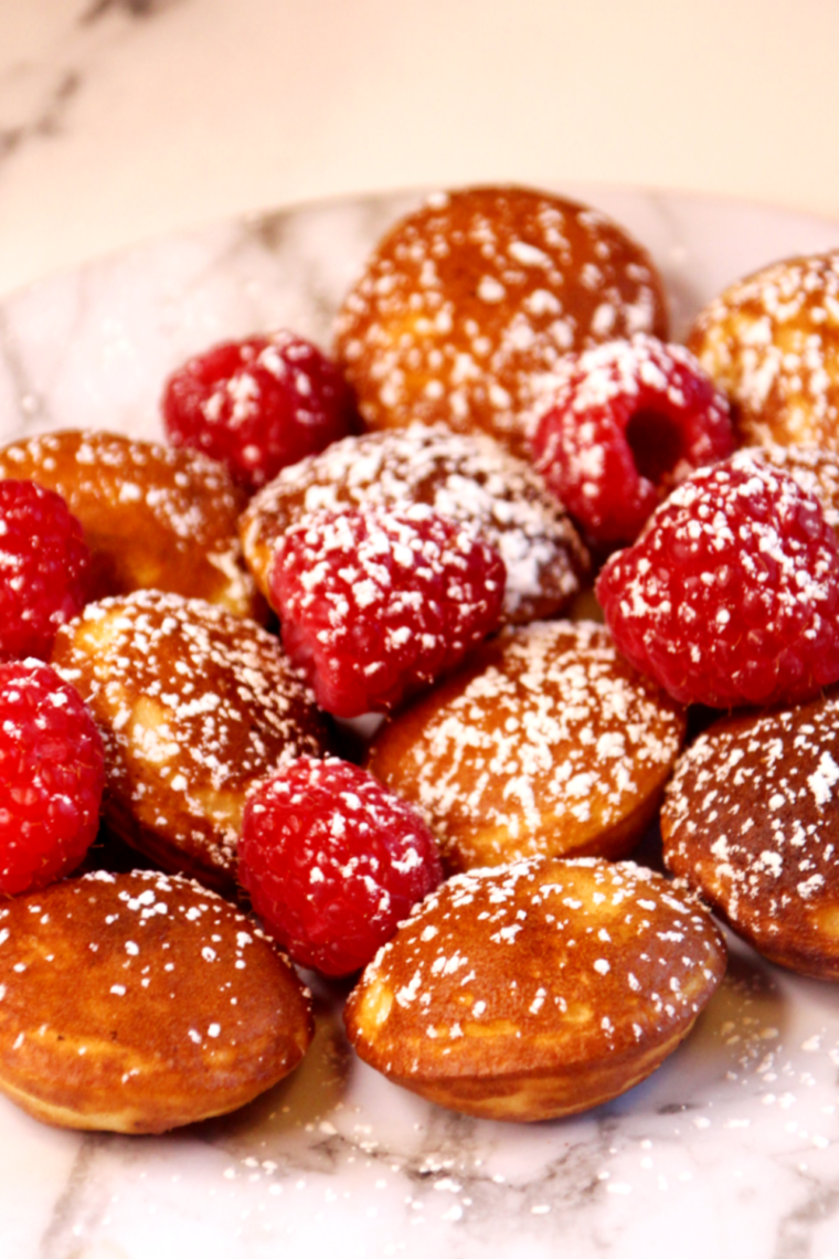 Air fryer basket filled with golden Trader Joe’s pancake puffs fresh and fluffy