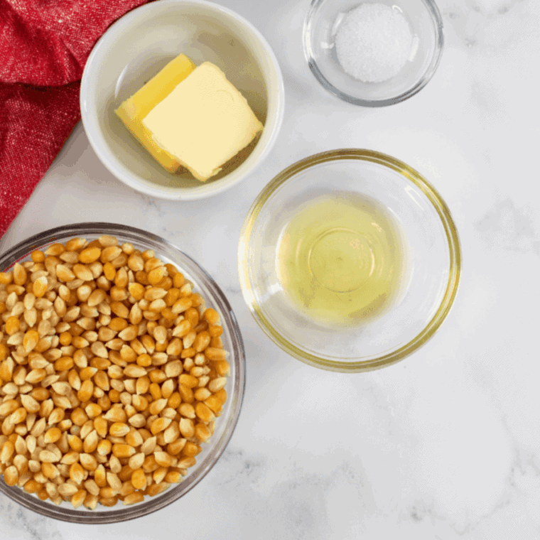 Ingredients for Blackstone popcorn: popcorn kernels, cooking oil, butter, and kosher salt