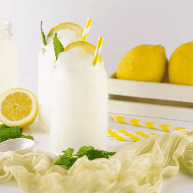 Frozen Ninja Creami lemonade slushi with icy texture served in a clear glass