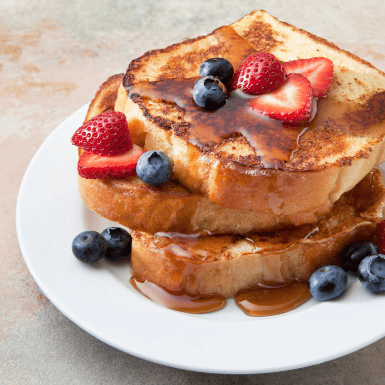 Why is my French toast soggy? It might be due to the bread being soaked in the mixture for too long or the bread being too fresh. Using slightly stale bread and ensuring a quick dip in the mixture can help prevent this issue. Can I use regular cow's milk instead of non-dairy milk? Yes, you can use regular cow's milk if you're not strictly avoiding dairy. The texture and flavor will be slightly different but still delicious. How do I store leftover eggless French toast? Store any leftovers in an airtight container in the refrigerator for up to 2 days. Reheat in the air fryer or oven to retain crispiness. Can I freeze eggless French toast? Yes, after cooking, let the French toast cool completely, then store in a single layer in a freezer-safe bag or container. Reheat in the air fryer straight from the freezer, adding a few minutes to the cooking time. Is it essential to use cornstarch? Cornstarch acts as a binder and gives the mixture a custard-like consistency. If you're out of cornstarch, you can substitute with arrowroot powder or even a bit of flour, although the texture may slightly vary. Can I add other flavorings to the mix? Absolutely! Feel free to experiment with flavors. Some popular additions are almond extract, orange zest, or even a splash of bourbon for an adult twist. Do I have to preheat my air fryer? While some air fryer models state that preheating is not necessary, doing so can help achieve a consistently crispy and golden exterior for your French toast. What's the best bread for making French toast? Denser bread like challah, brioche, or Texas toast works best as they hold the mixture well without becoming overly soggy. Why go eggless? There are various reasons people opt for eggless recipes, including allergies, dietary preferences, vegan lifestyles, or simply running out of eggs! Can I use this recipe for a stovetop version? Yes, while this recipe is tailored for an air fryer, you can adapt it for a stovetop by cooking the soaked bread slices on a non-stick skillet over medium heat until golden brown on both sides.