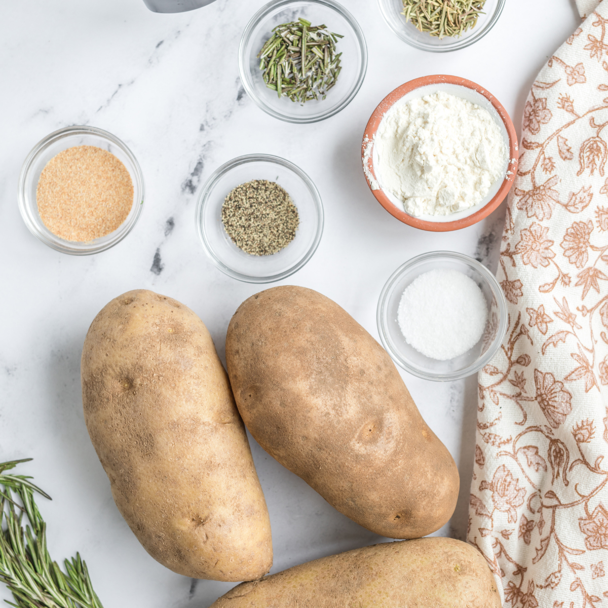 Ingredients needed for Crispy Blackstone Smashed Potatoes on kitchen table.