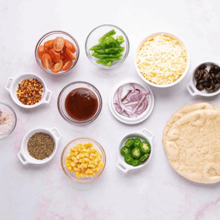 Ingredients needed for Easy Air Fryer Weight Watchers Pita Pizza on kitchen table.