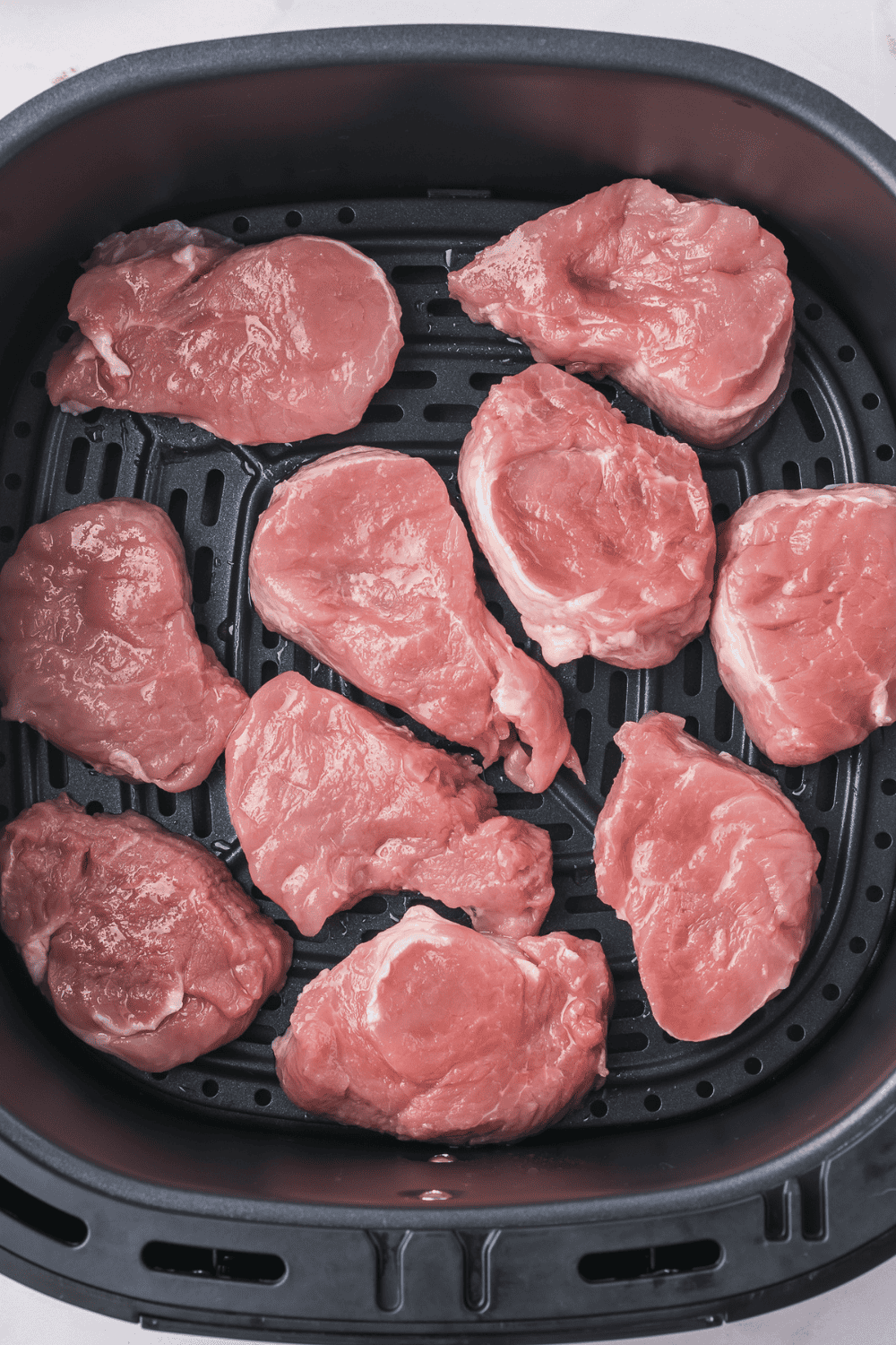 Air fryer preheating to 400°F with lightly sprayed basket to prevent sticking"