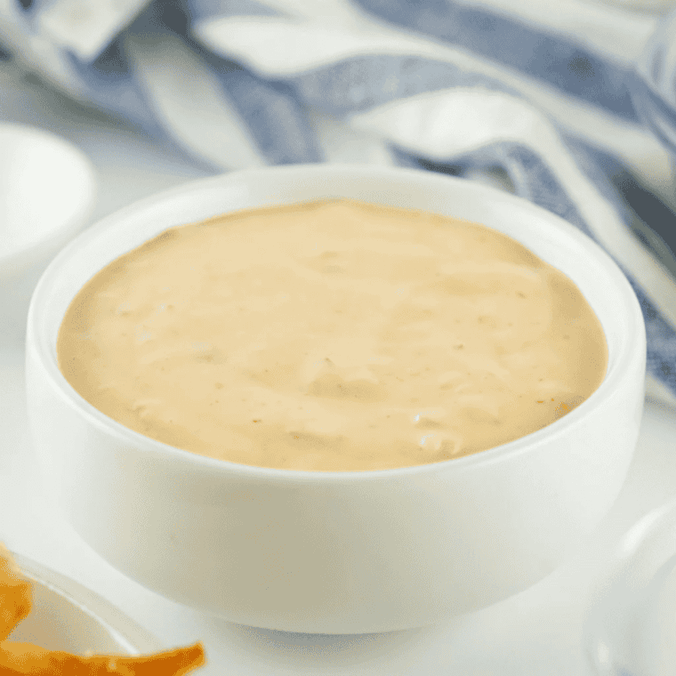 Homemade Shake Shack copycat burger sauce in a small bowl with a spoon.