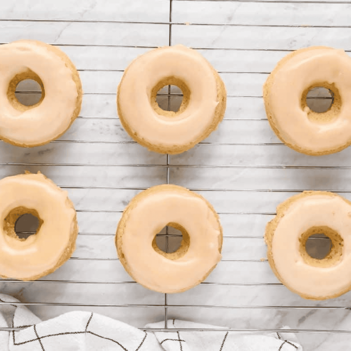 Air fryer protein donuts glazed and stacked on a plate, ready in 20 minutes