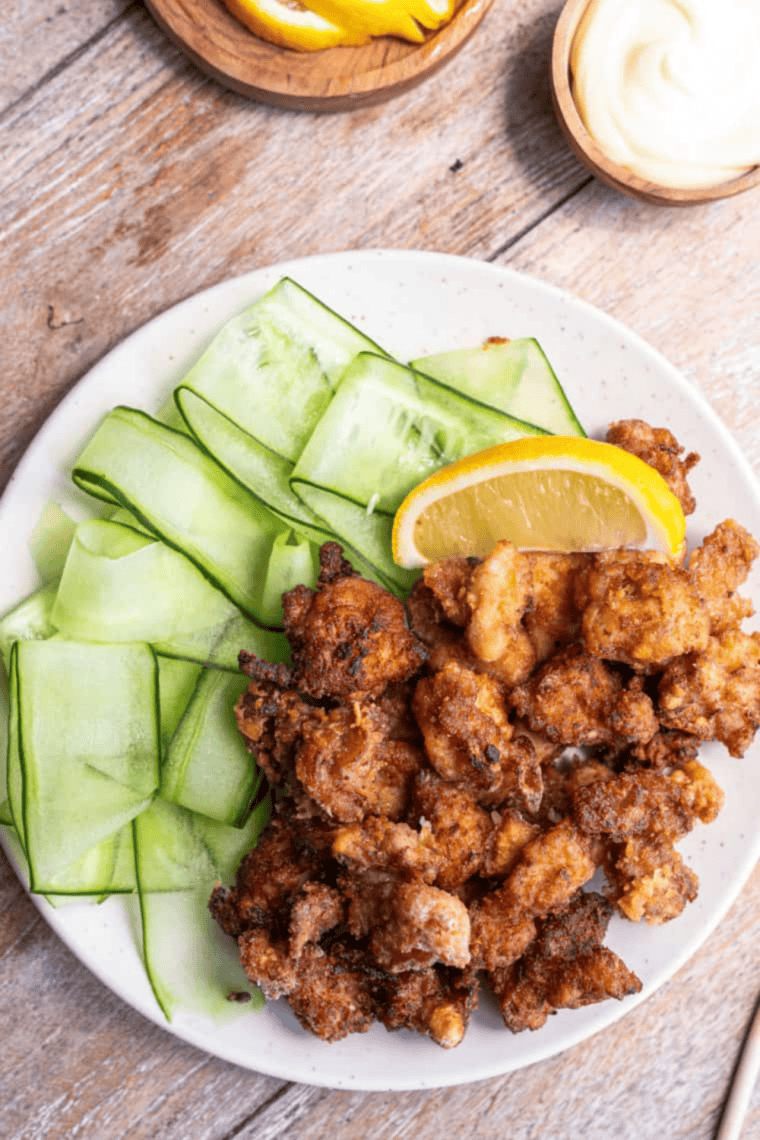 Crispy air fryer karaage Japanese fried chicken served with lemon wedges and dipping sauce