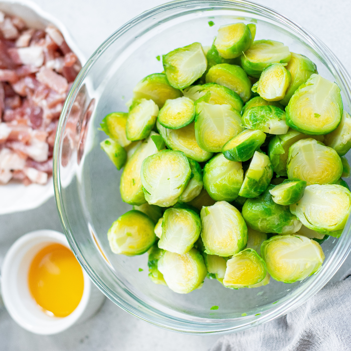 Ingredients needed for Blackstone Brussels Sprouts on kitchen table.