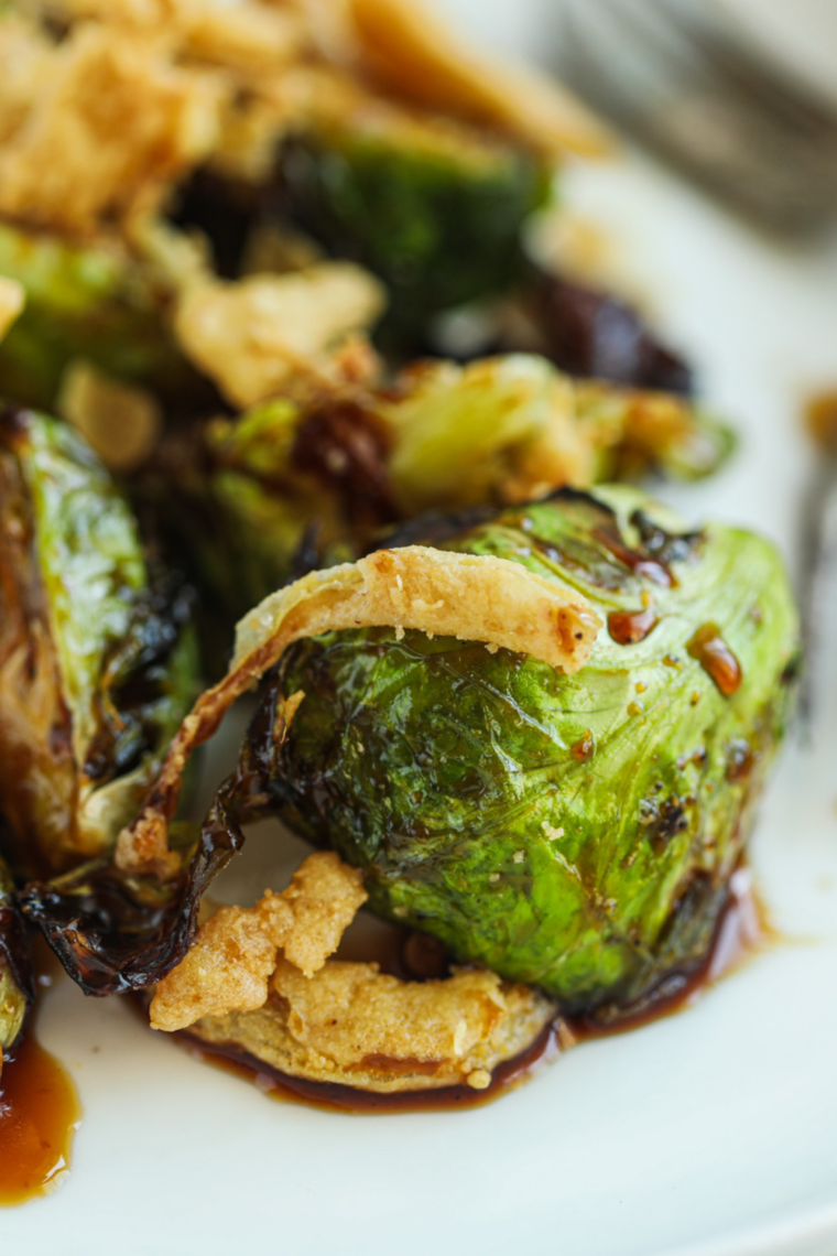 Caramelized Brussels sprouts seasoned with brown sugar and smoked paprika on a Blackstone griddle.
