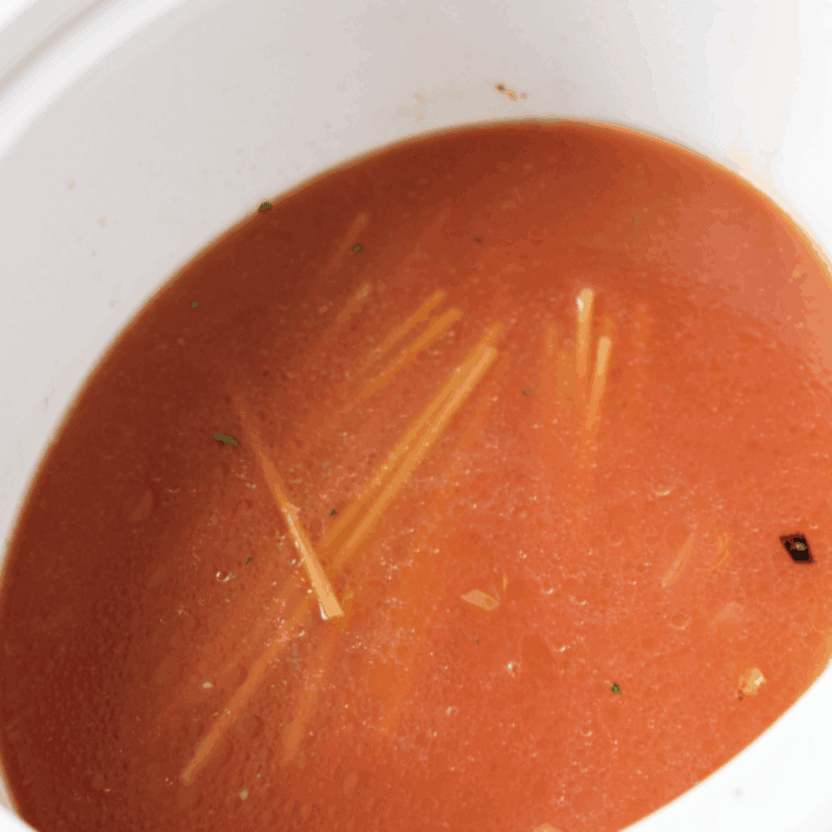 Stir in shrimp and tomato paste, cooking until shrimp is fully cooked and pink.