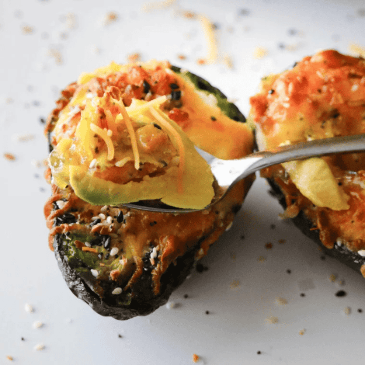 air fryer stuffed avocado with creamy savory filling served on plate